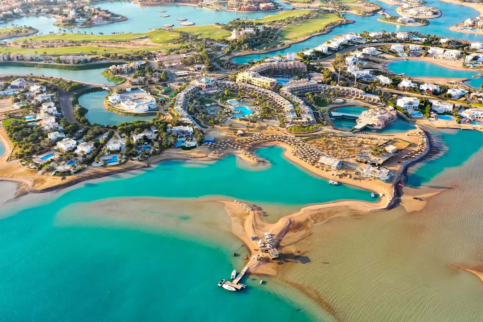 Aerial view of El Gouna: turquoise lagoons, islands and the Red Sea at golden hour